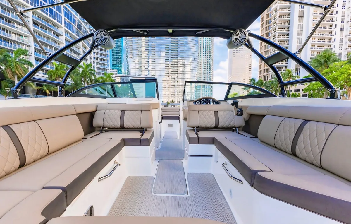 A 29-foot SeaRay cruising Biscayne Bay on a private boat tour in Miami with the downtown skyline behind